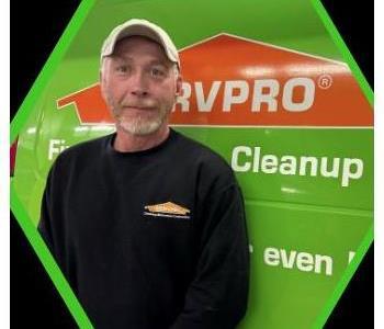 Male SERVPRO employee in black shirt.